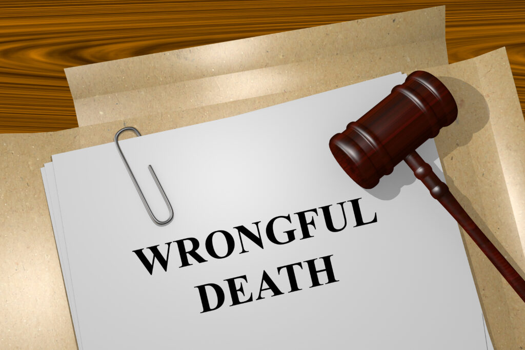 Wrongful death legal document on a desk with a judge&rsquo;s gavel and paper stack.