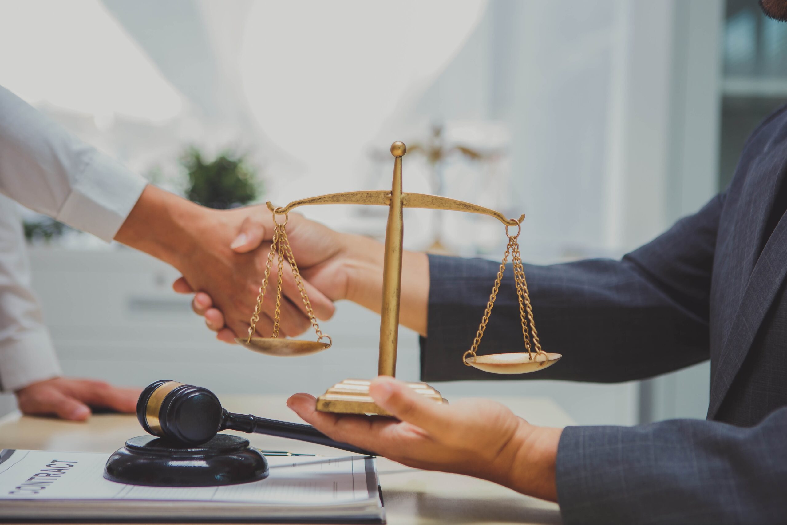Personal Injury Attorney handshaking with a client