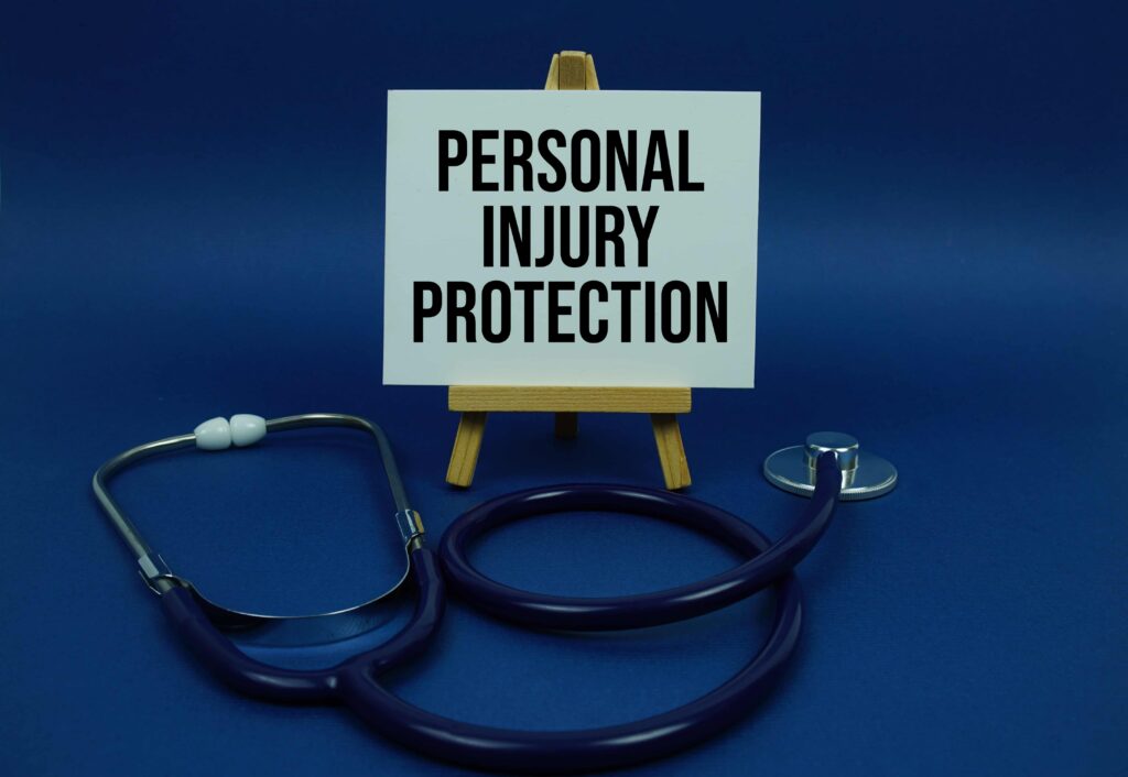 Personal injury protection insurance sign with stethoscope, representing PIP coverage and medical expense benefits after an accident.