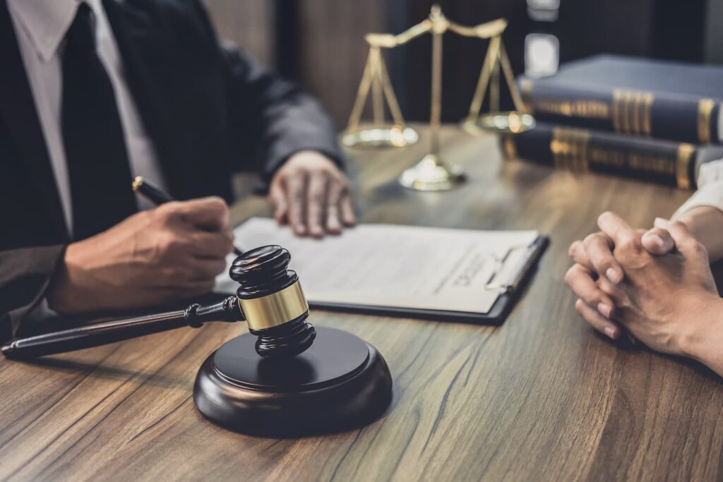 Arlington Personal Injury Lawyer Reviewing Case Documents With Client Arlington personal injury lawyer reviewing case documents with client during legal consultation