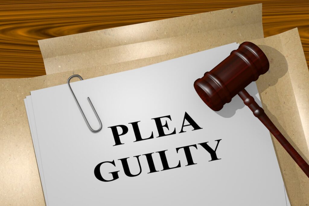 Guilty Plea in Criminal Cases and Its Impact on Civil Wrongful Death Claims Guilty plea document with judge gavel representing criminal case admission impacting civil wrongful death claims