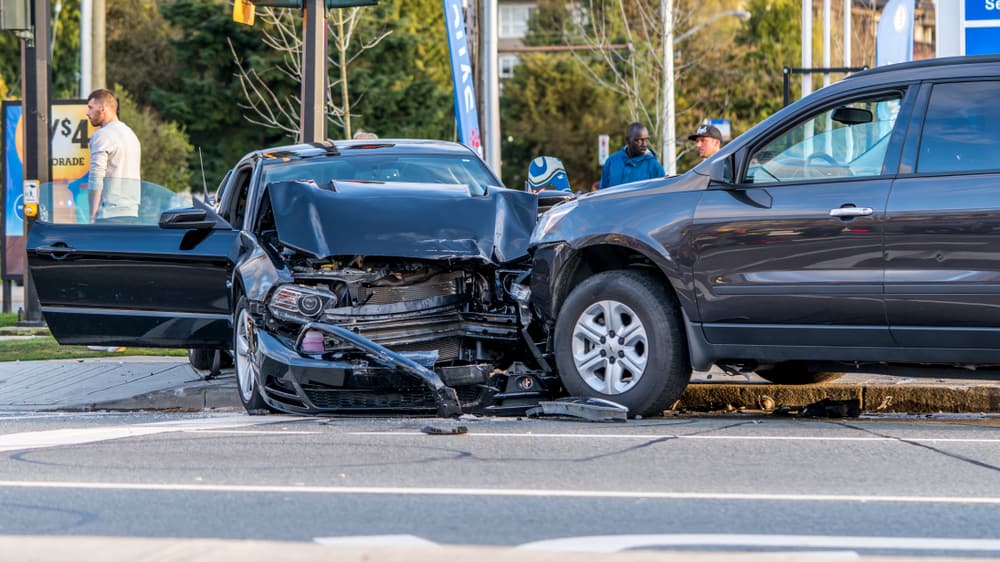 two vehicles with significant front-end damage at an intersection