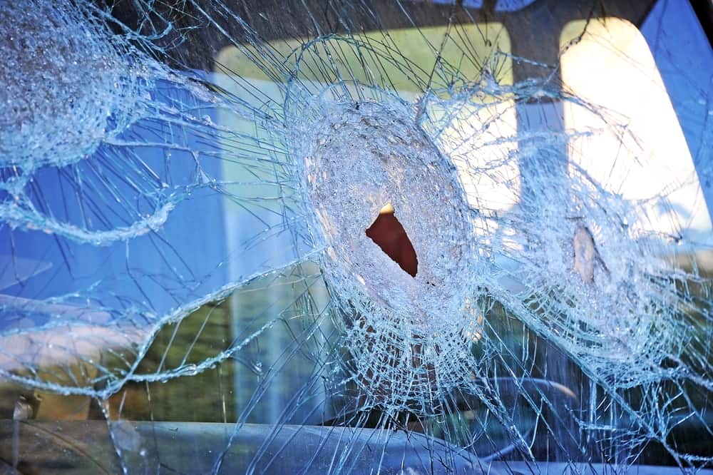 close up of a shattered truck window after a crash